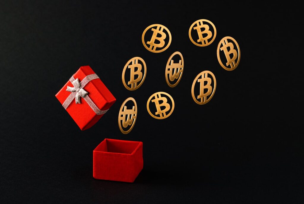 Cryptocurrency gift concept; bitcoins coming out of a gift box